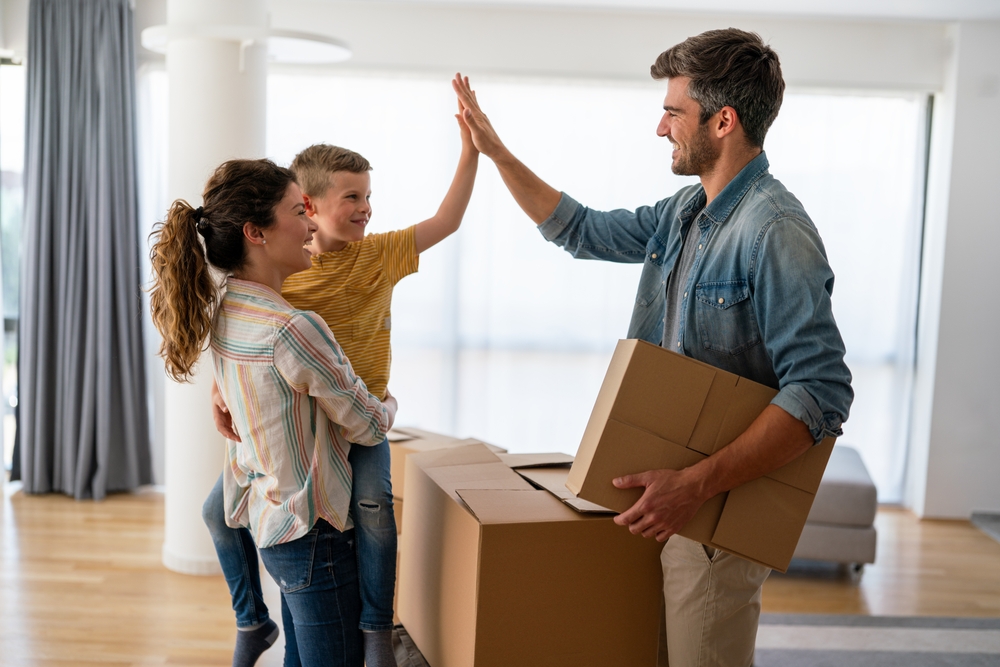 Happy Family with New House - Forge Home Consulting